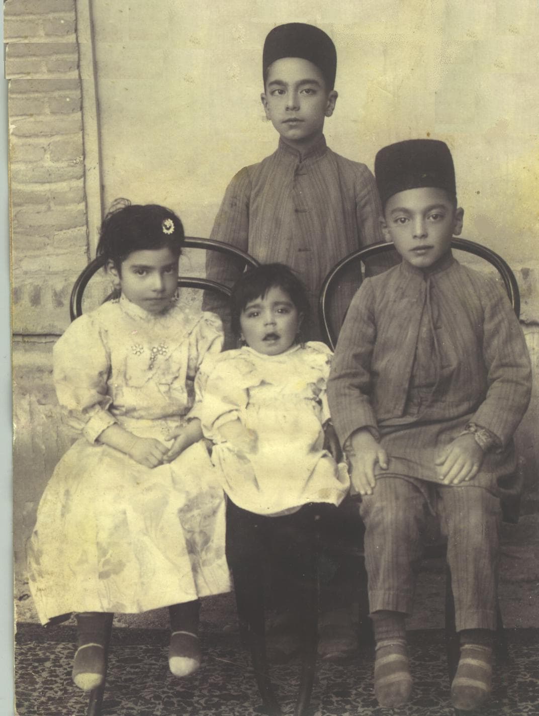 Center, Iran Farshi with her step sister and step brothers.